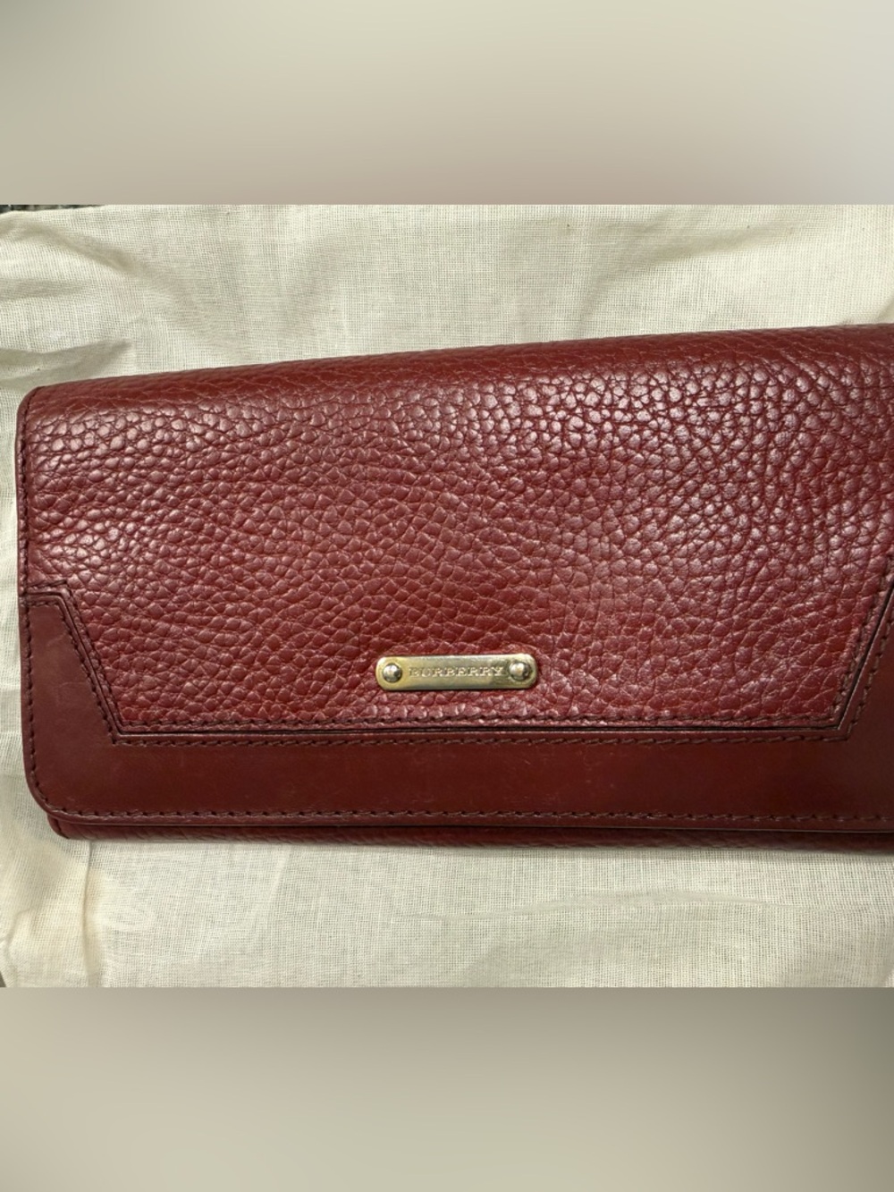 Burberry Burgundy Pebbled Leather Continental Wallet with Gold Plaque